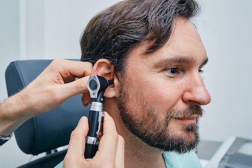 Man receiving hearing exam