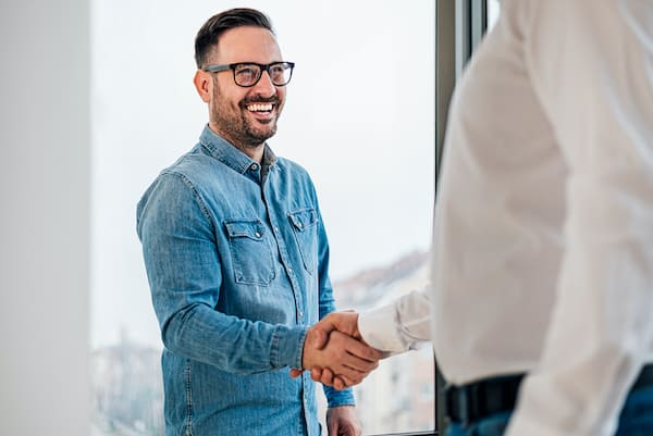 Businessman greeting Job applicant